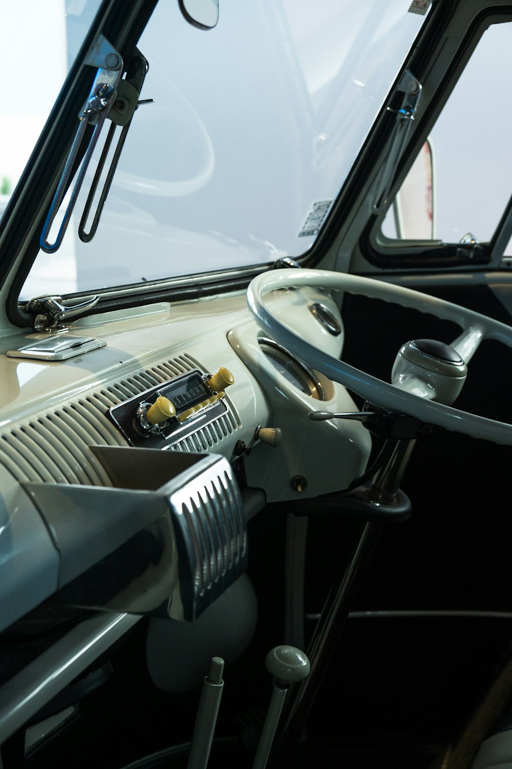 the inside of a bus with a steering wheel
