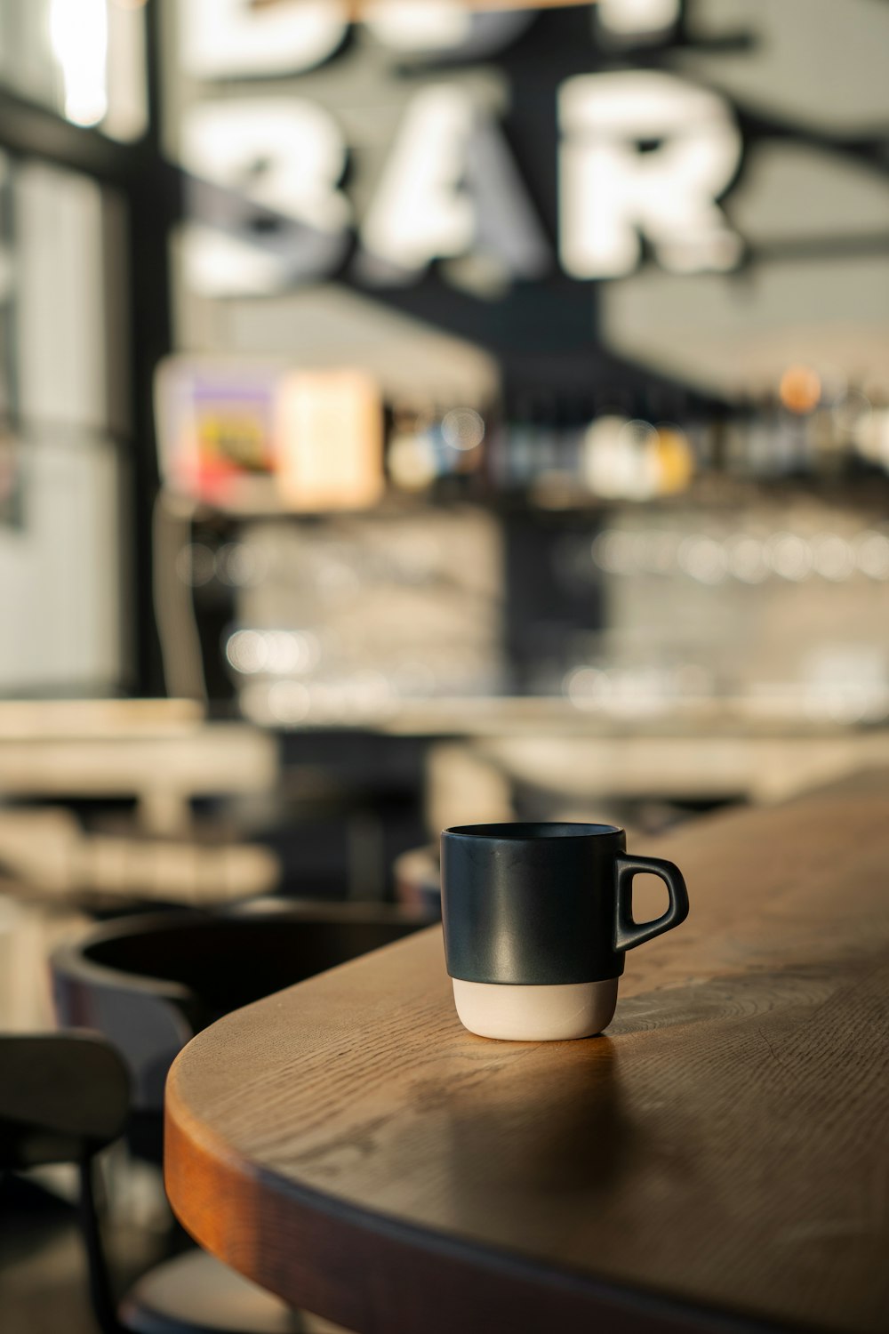 a coffee cup sitting on top of a wooden table