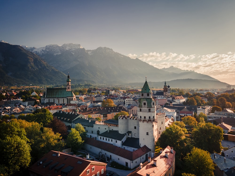 a view of a town with mountains in the background