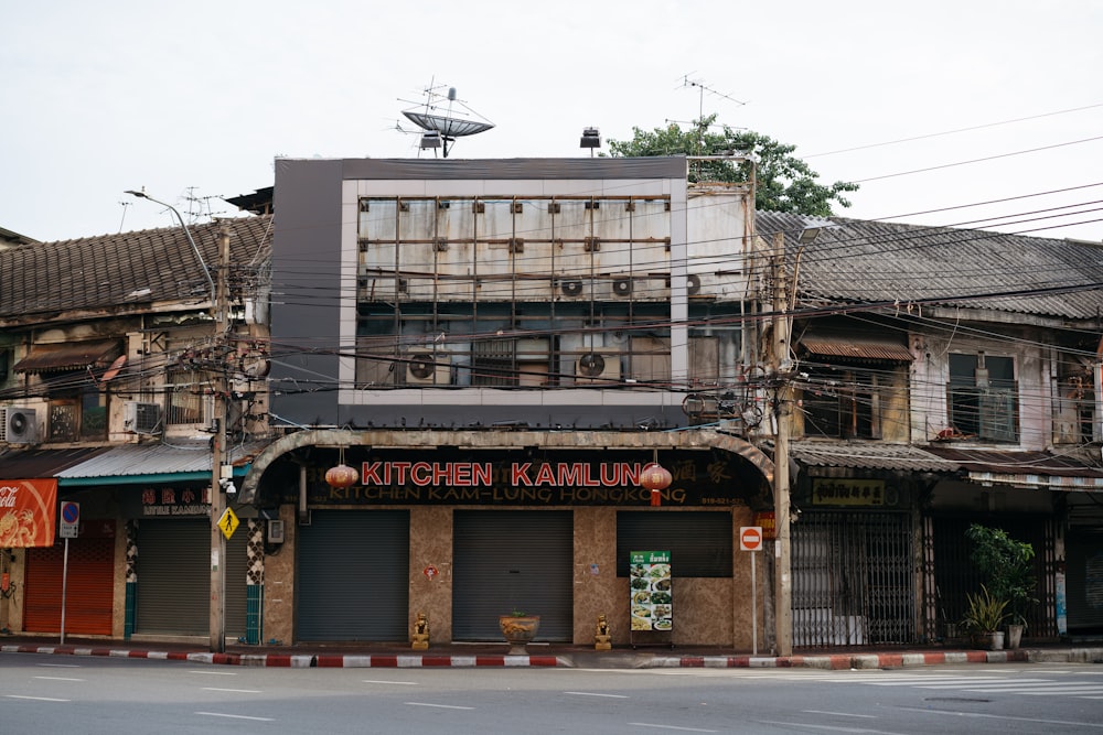 a street corner with a building with a satellite dish on top of it