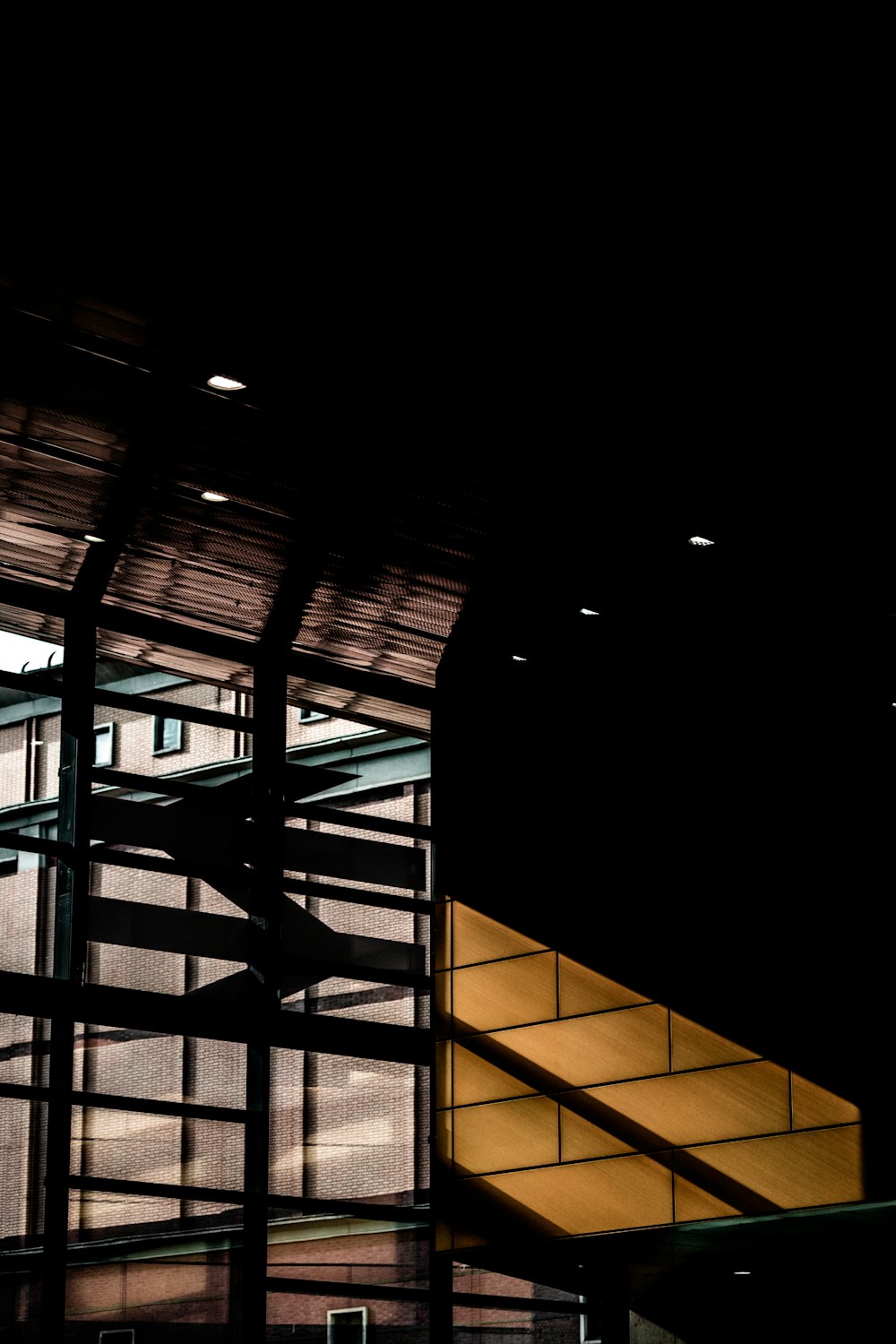 a large building with a yellow stair case next to it