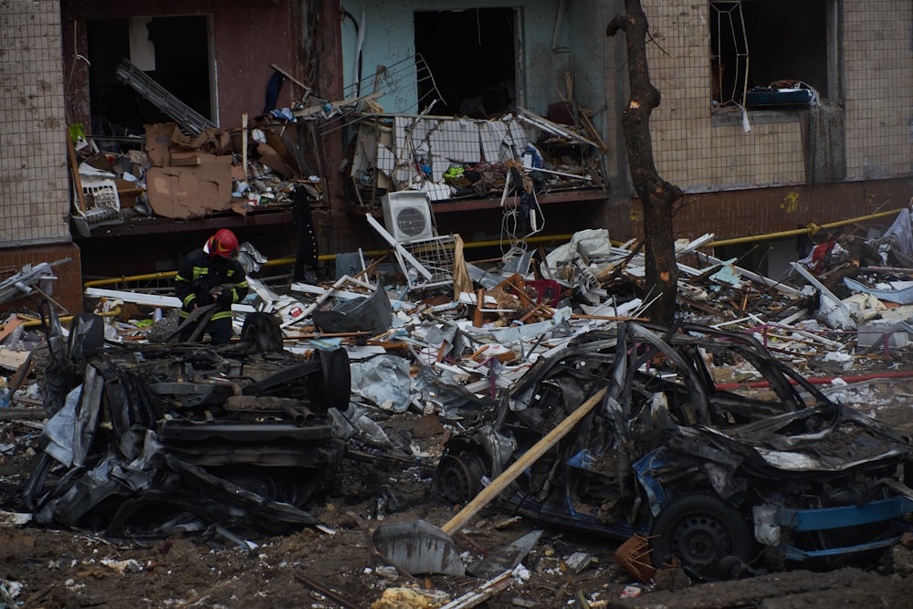 a pile of rubble next to a building