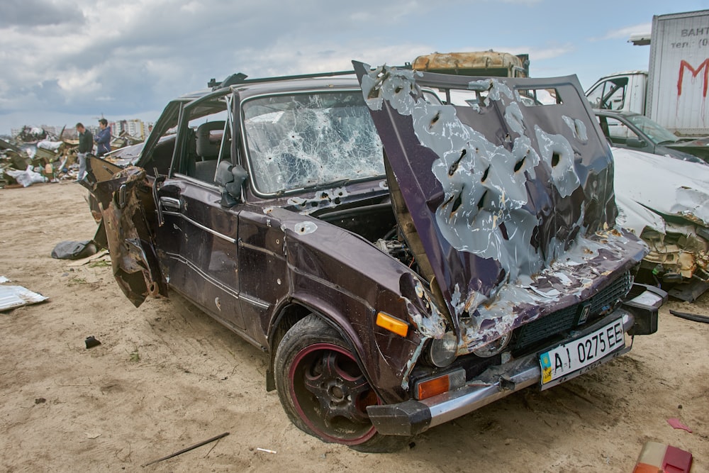 a car that is sitting in the dirt