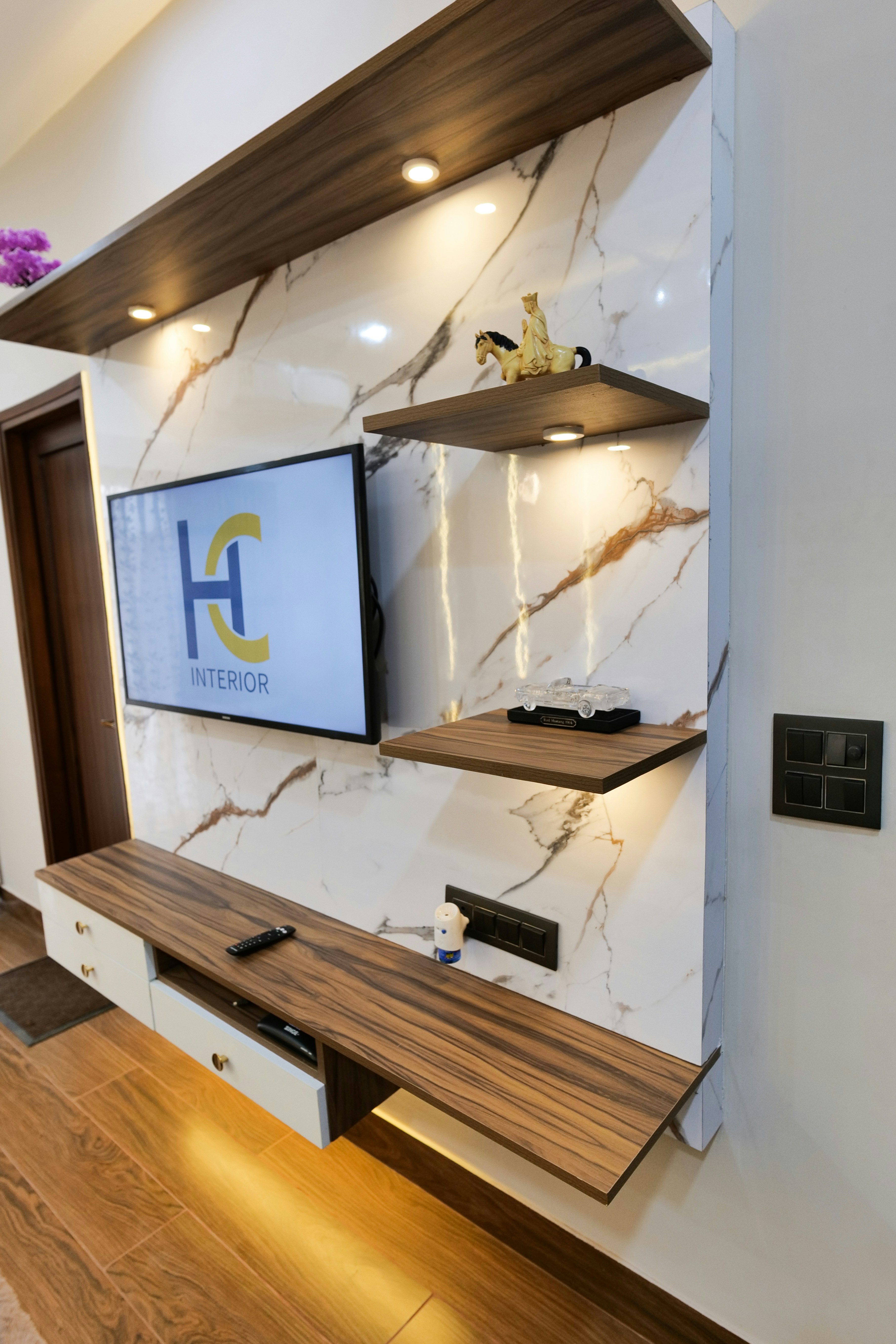 Modern wooden TV entertainment unit with open shelves in bright airy room