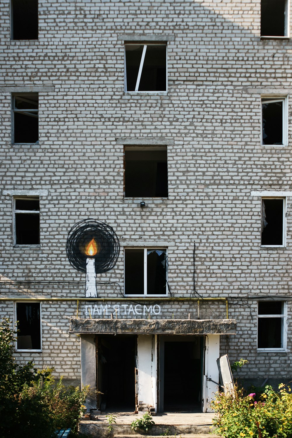 a brick building with a fire hydrant in front of it