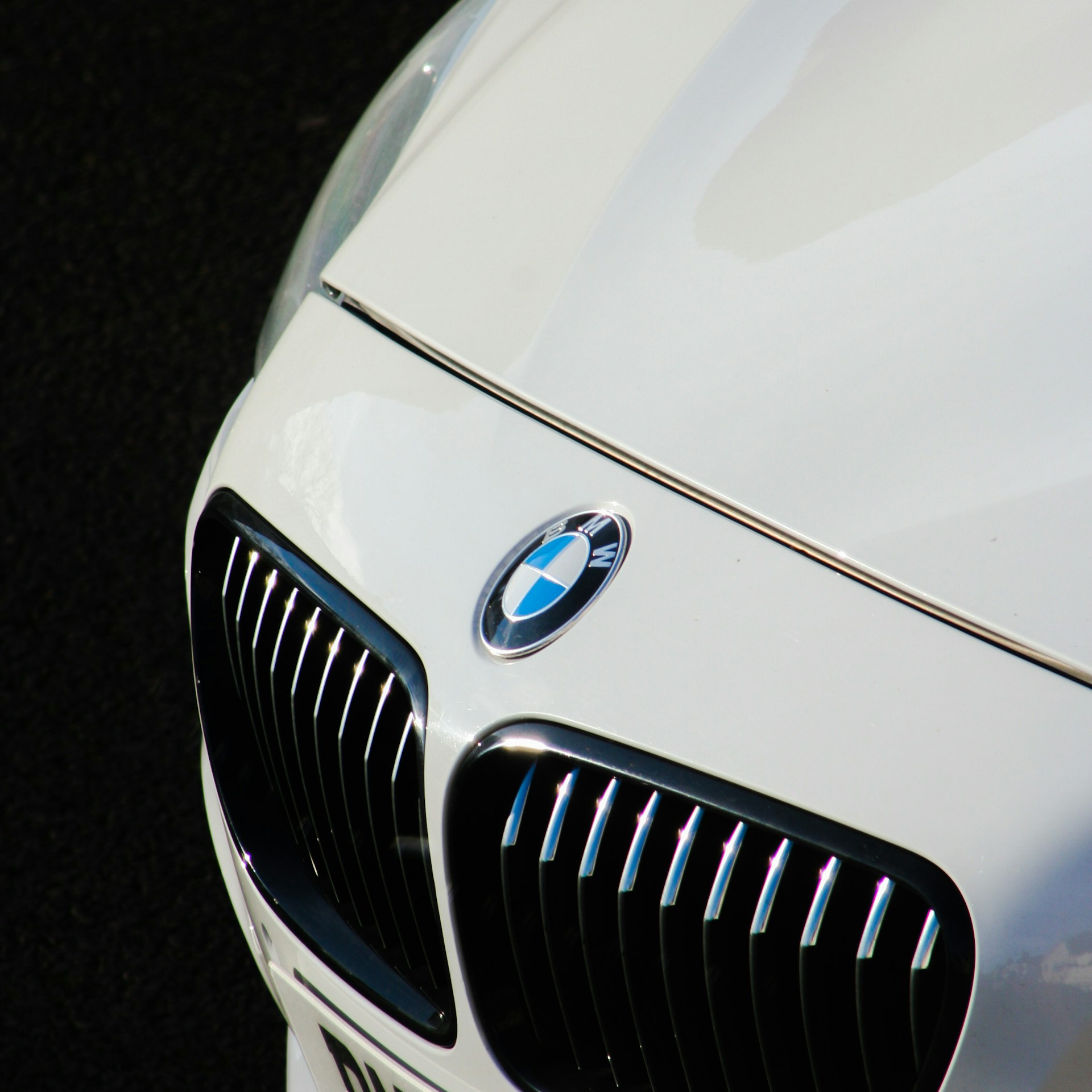 a close up of the front of a white car