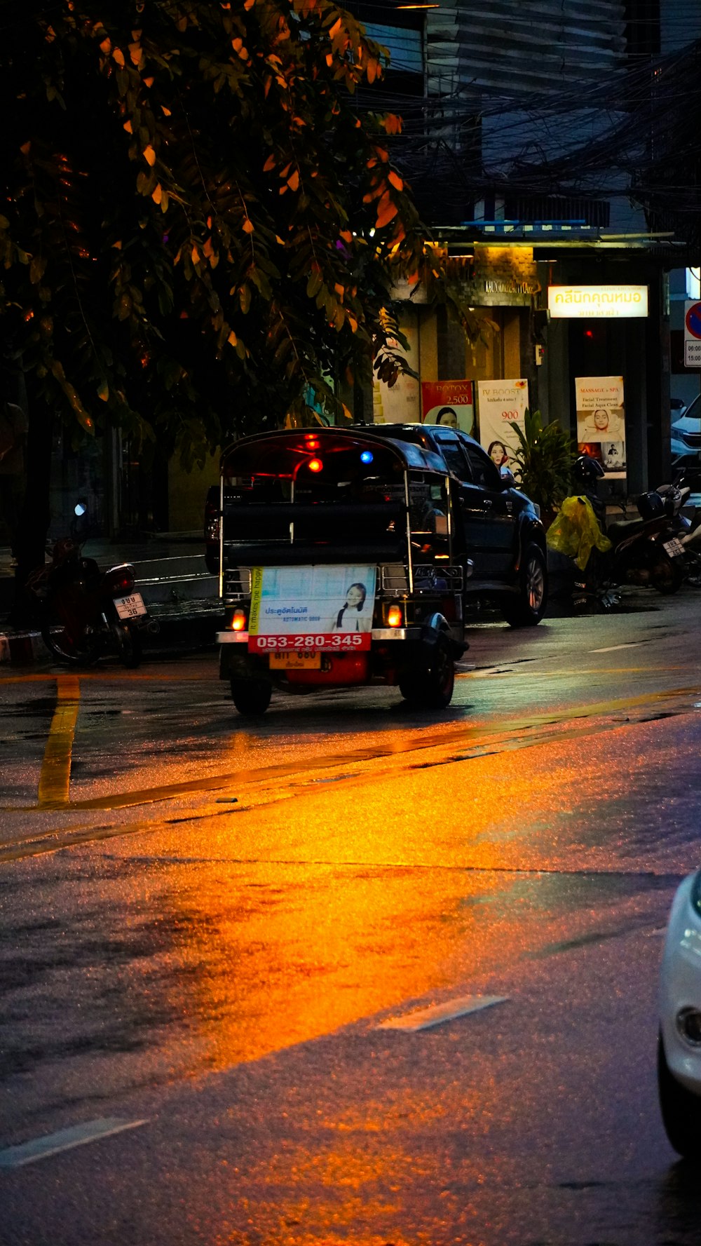 a bus driving down a street at night