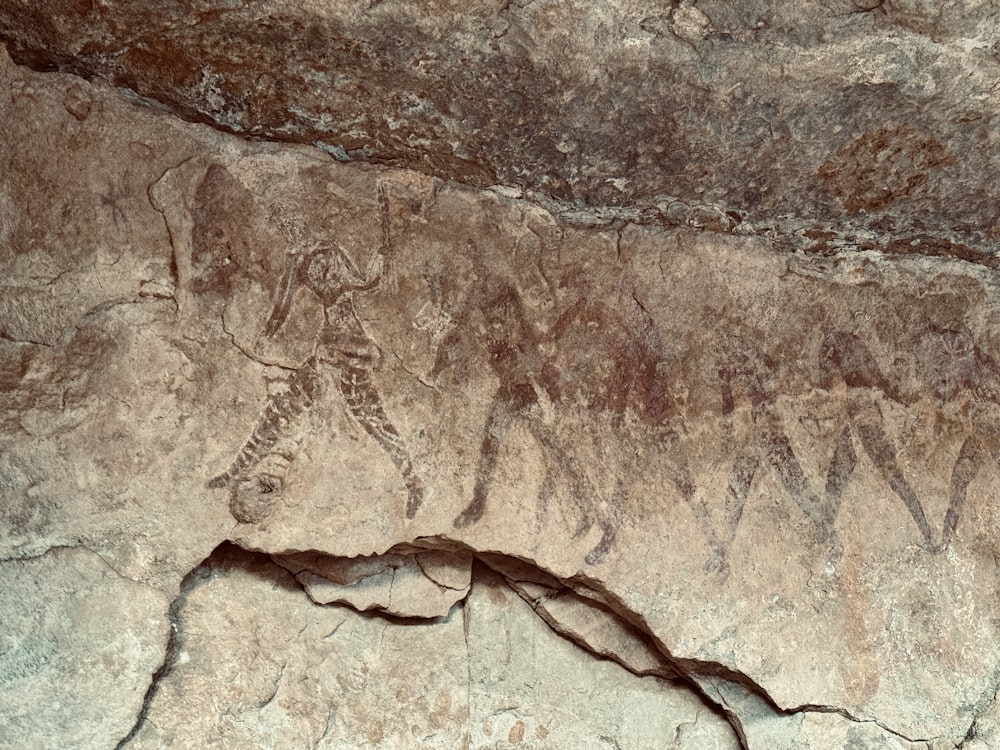 a large rock with some animals on it