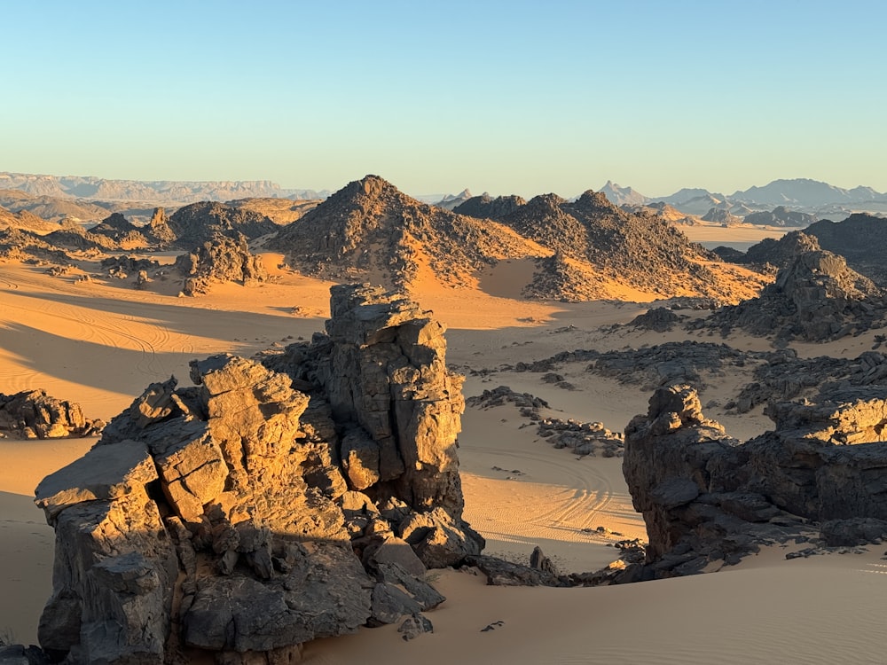 a desert landscape with rocks and sand