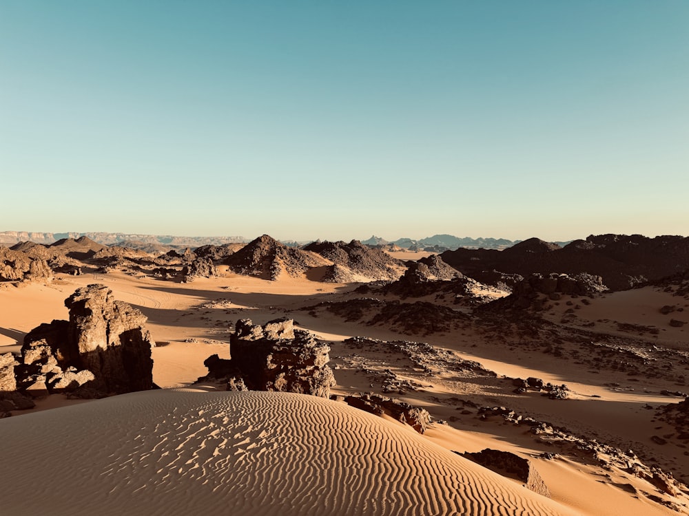 a desert landscape with rocks and sand