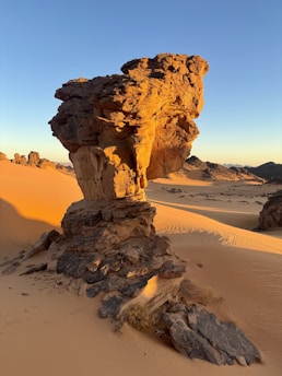 a rock formation in the middle of a desert