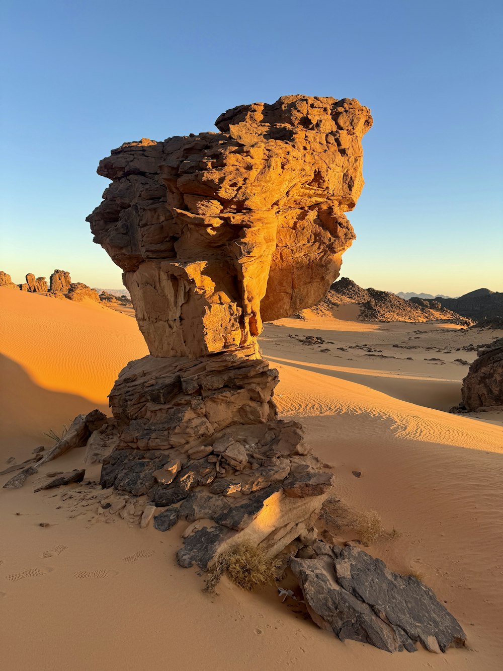 a rock formation in the middle of a desert