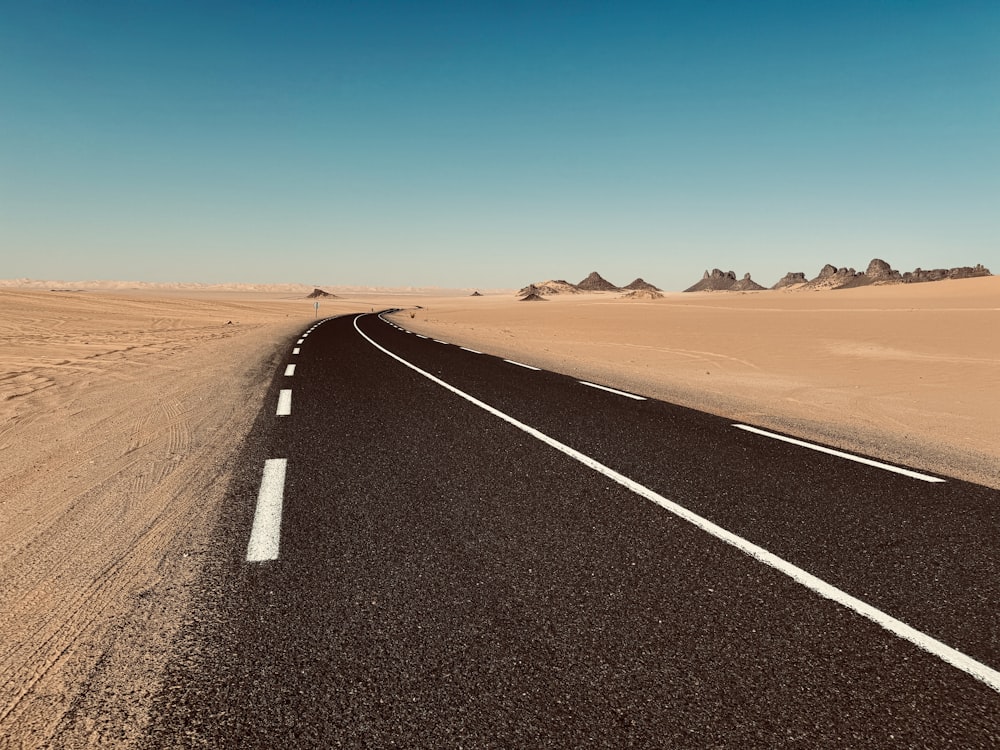 a desert road in the middle of the desert