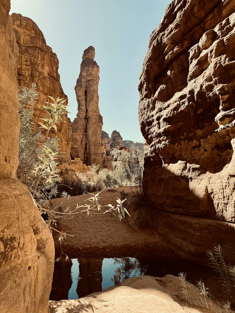 a large rock formation in the middle of a desert