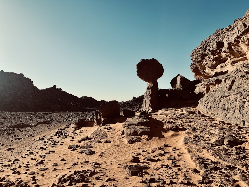 a rock formation in the middle of a desert