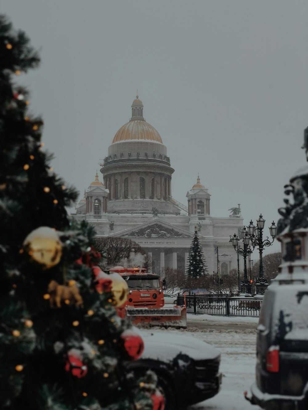 a christmas tree in front of a large building