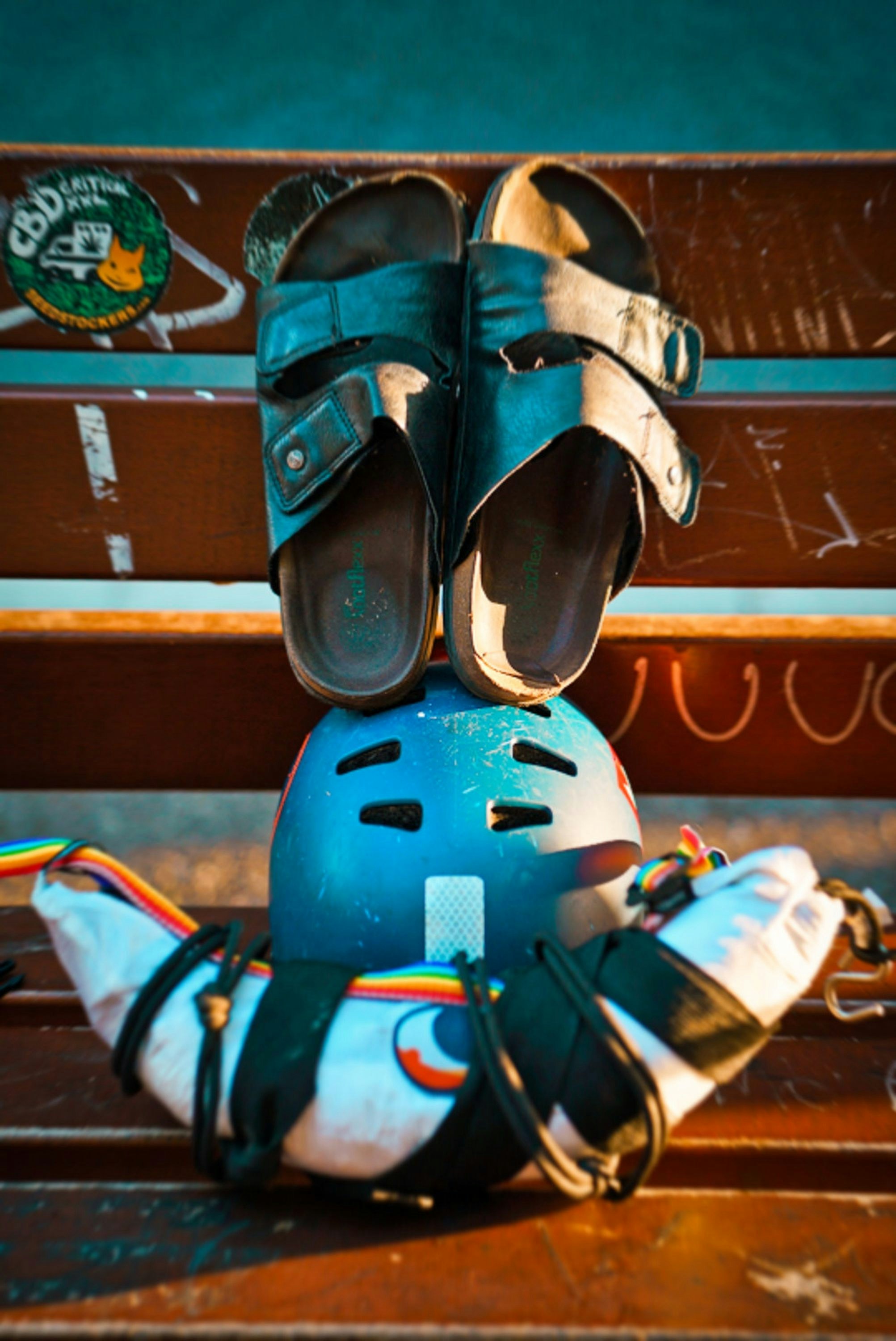 a pair of shoes sitting on top of a skateboard