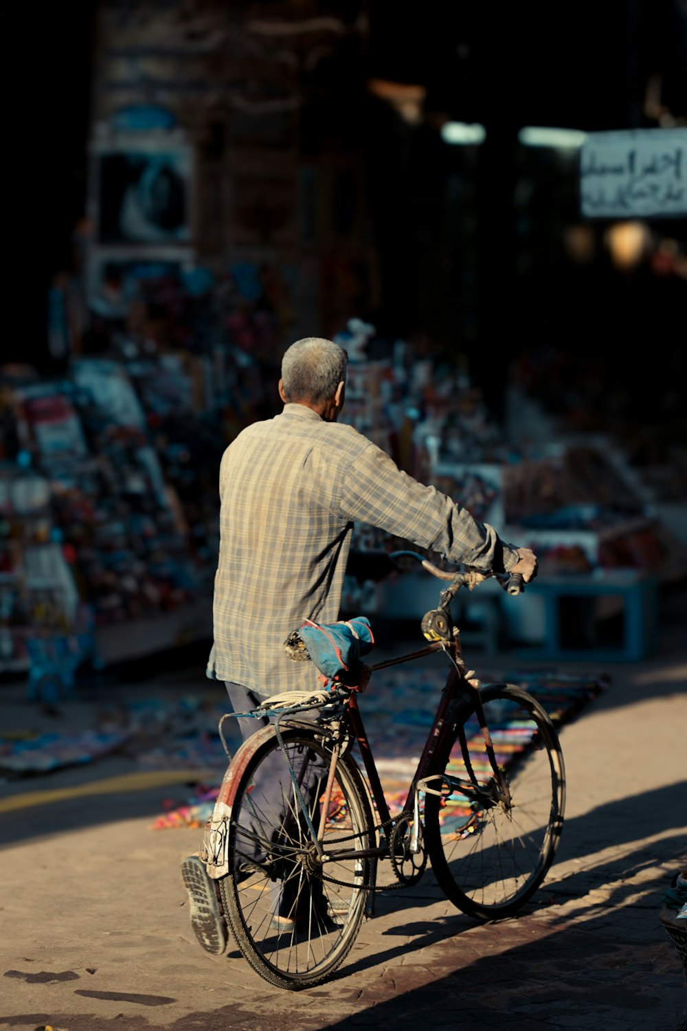 a man riding a bike down a street