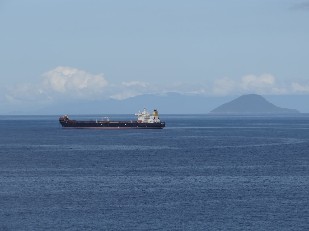 a large cargo ship in the middle of the ocean