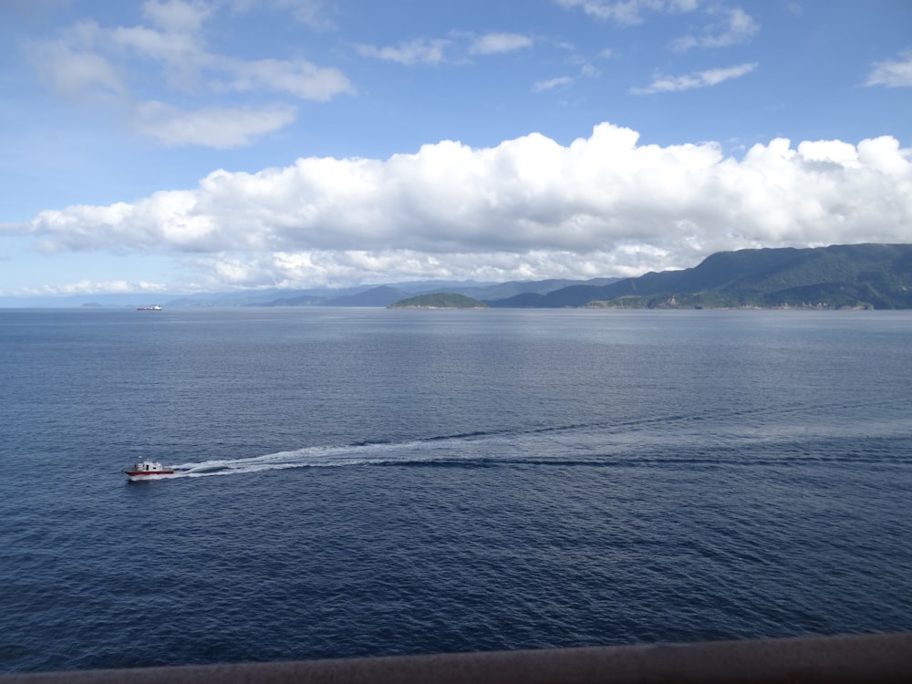 a boat traveling across a large body of water