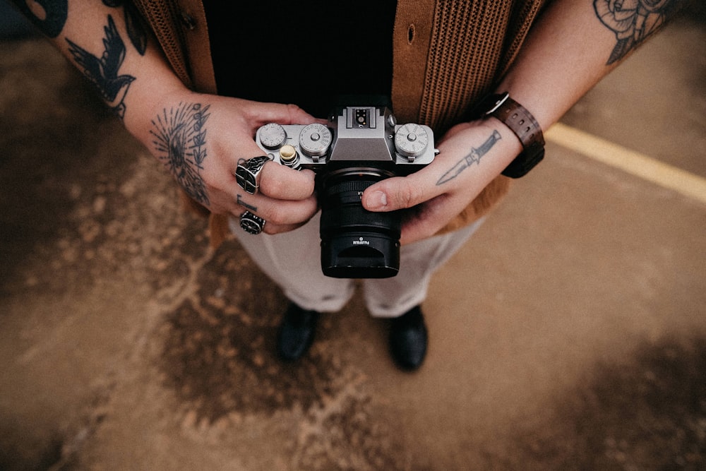 a person holding a camera in their hands