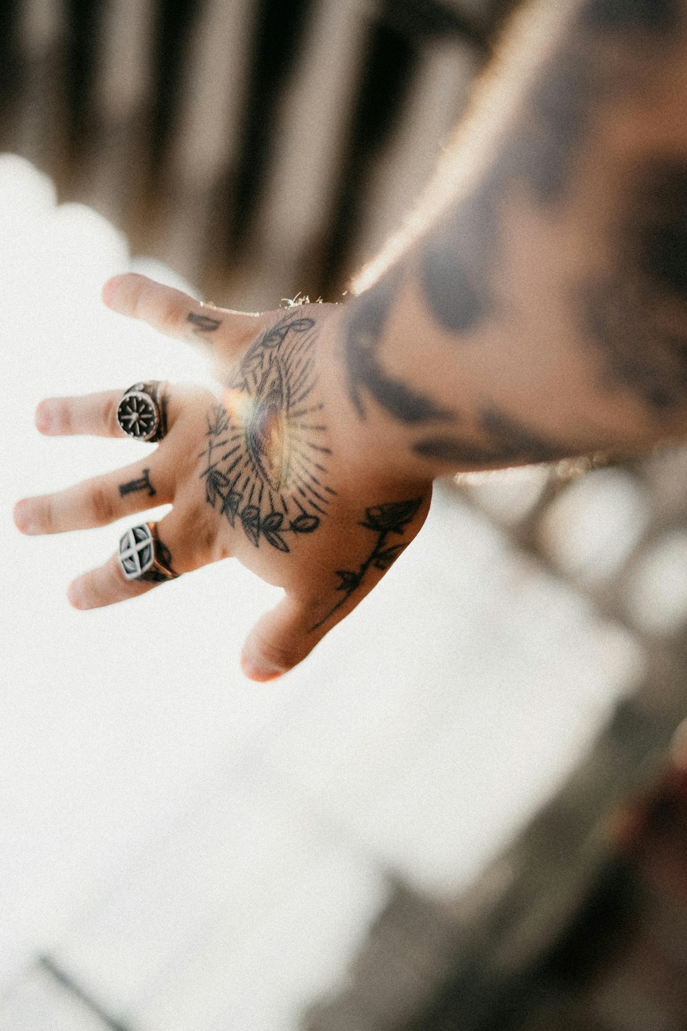 a person with a tattoo on their hand