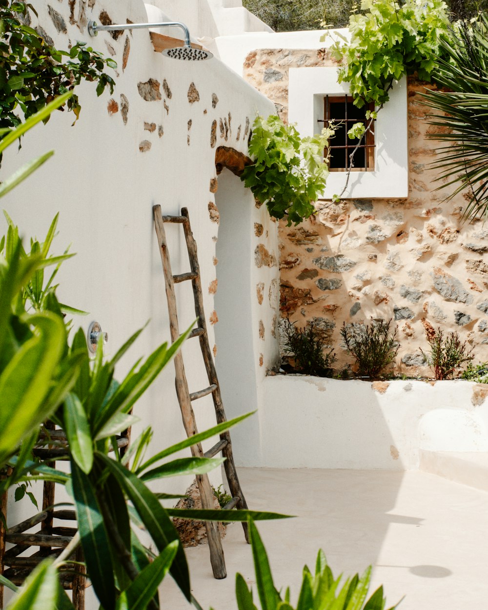 a ladder leaning against a wall next to a window