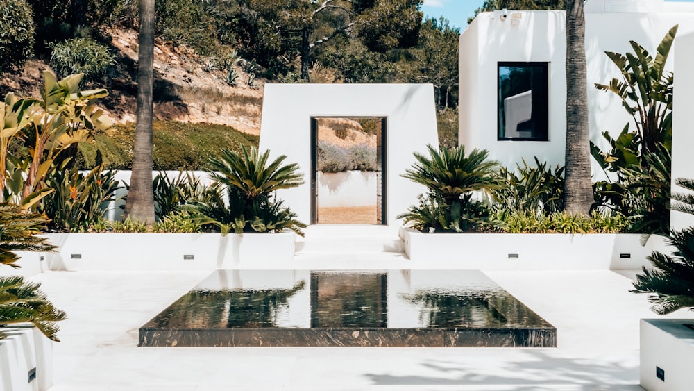 a white house with a glass table in front of it