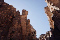  Rock formations and desert vegetation in Essendilène Canyon, Algeria.