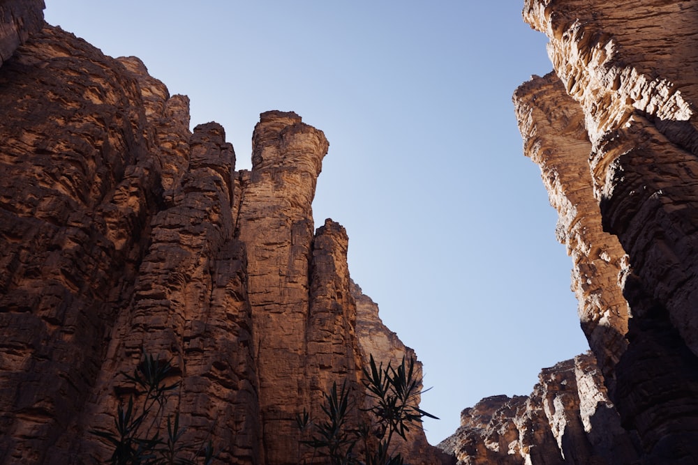 a view of the sky through some rocks