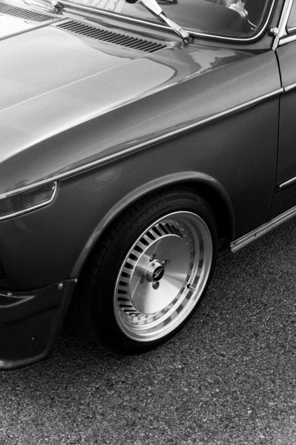 a black and white photo of a car