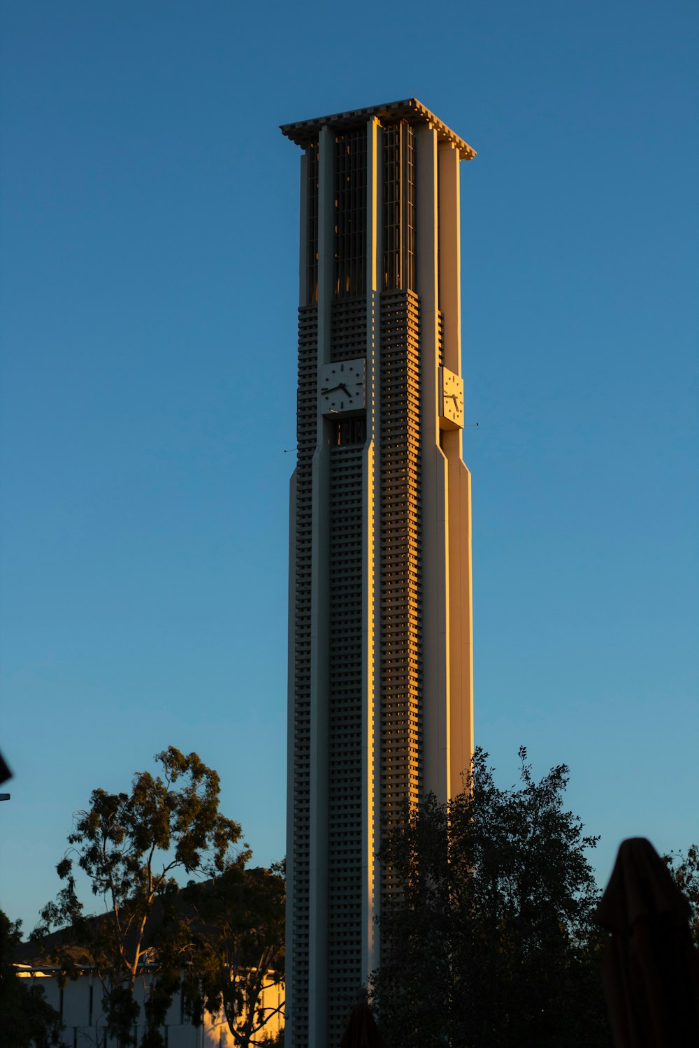 a very tall building with a clock on it's side