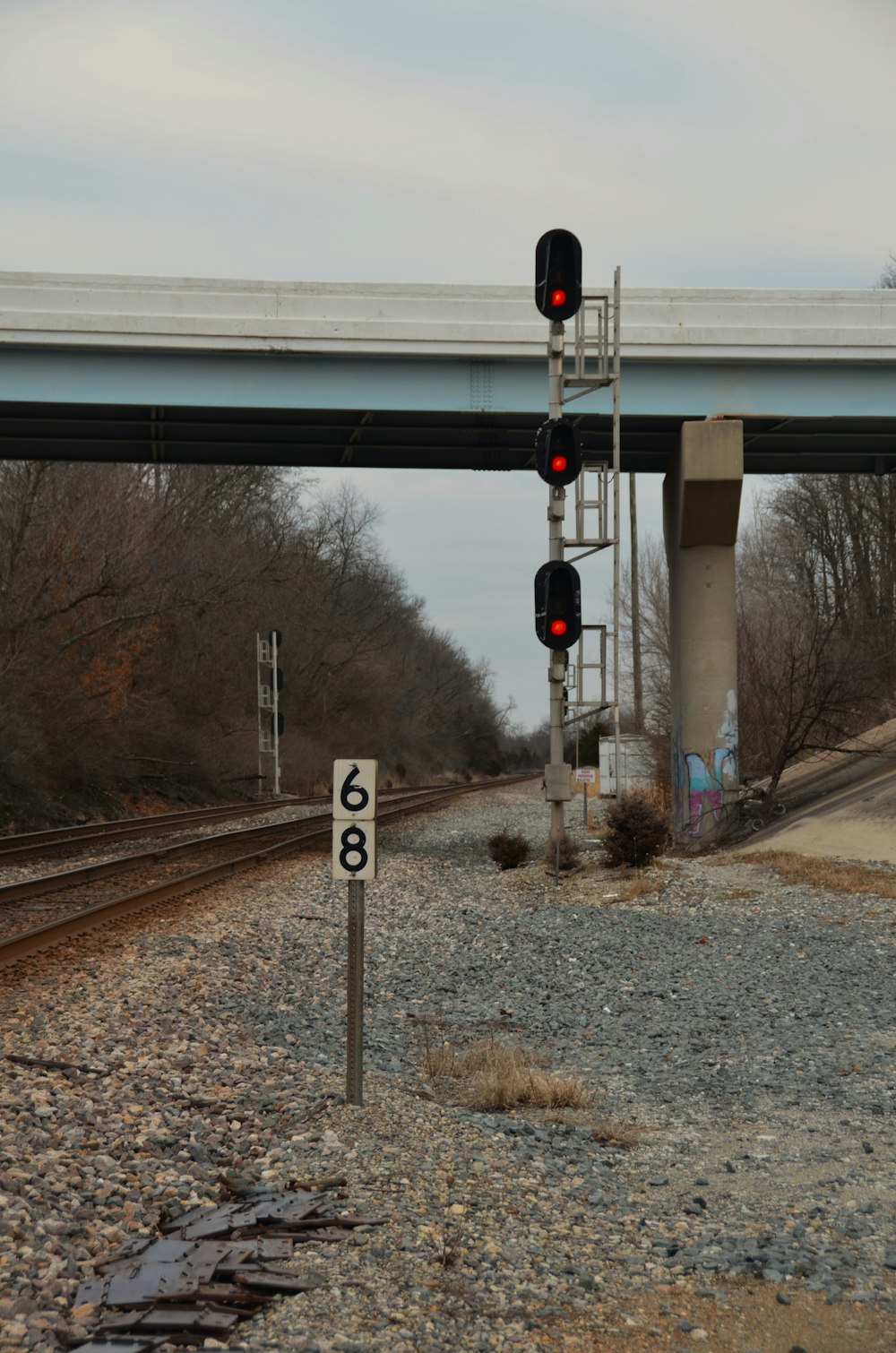 a railroad crossing with a railroad crossing signal