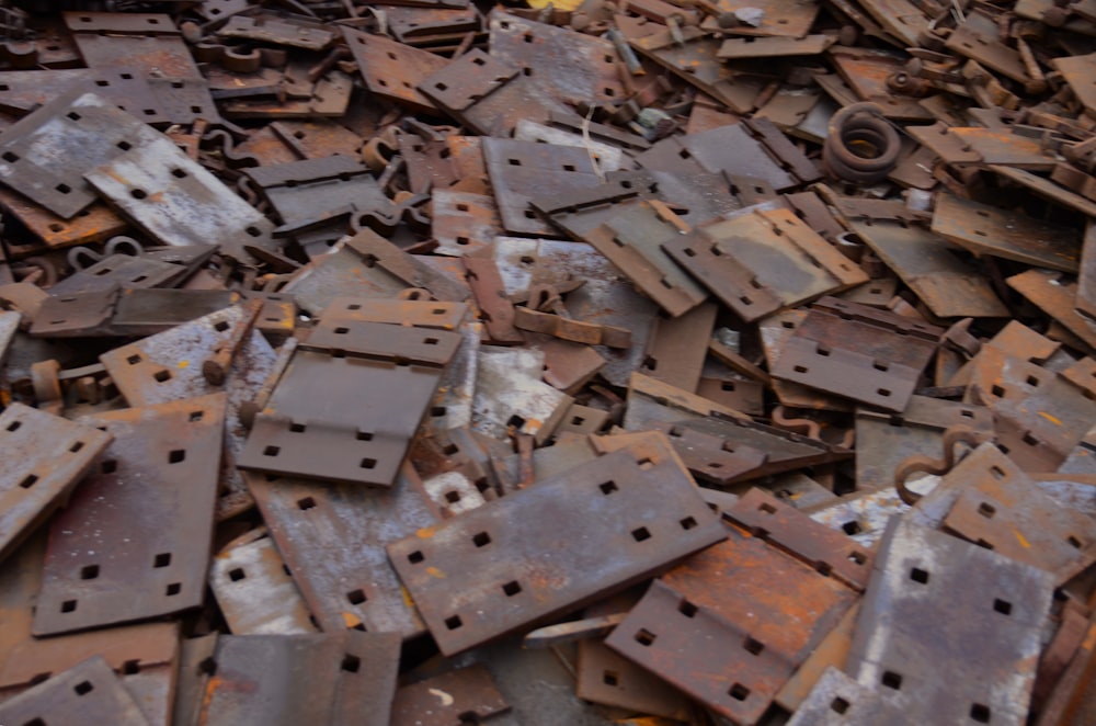 a pile of rusty metal pieces sitting on top of each other