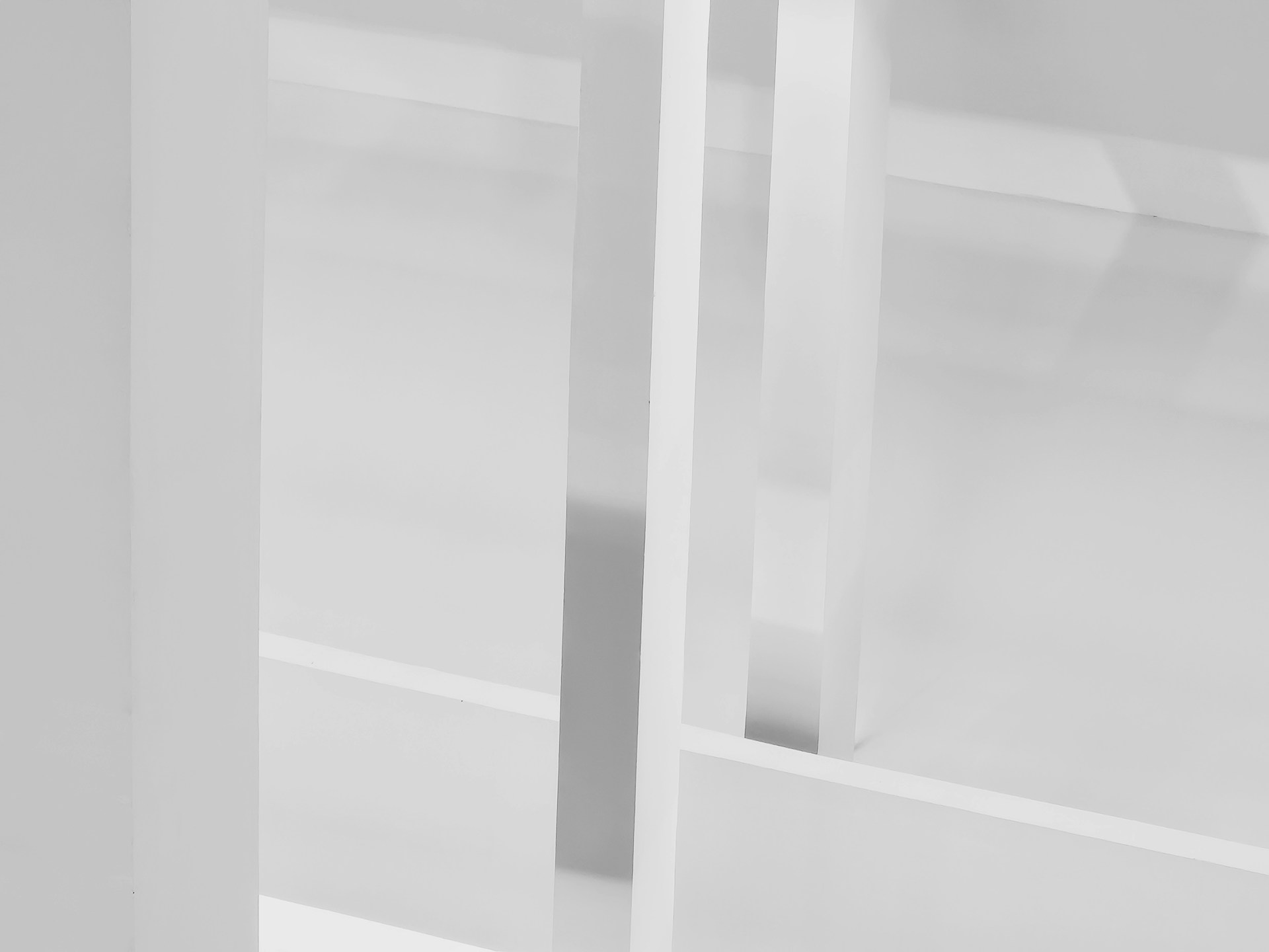 a black and white photo of a glass door