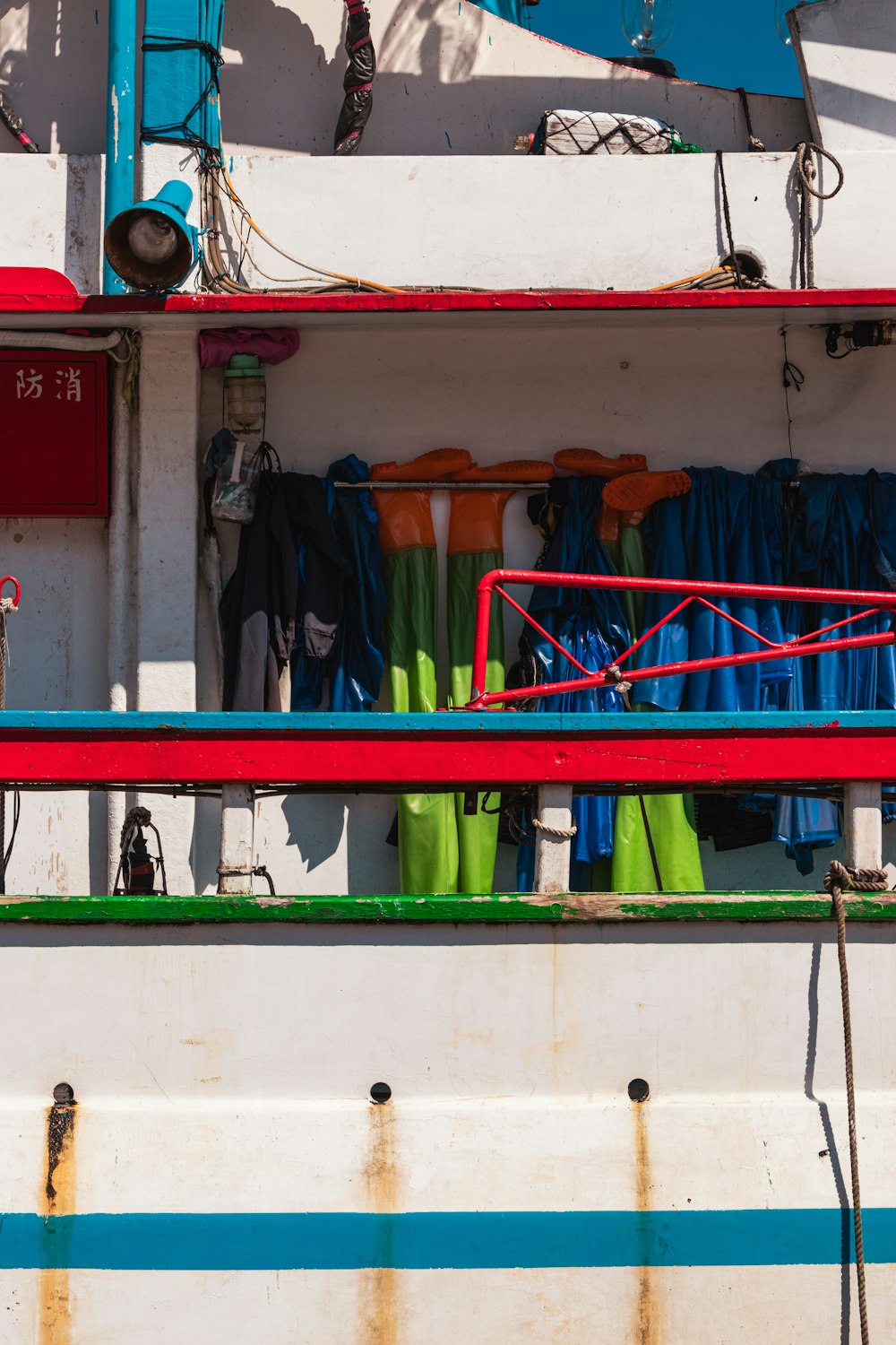 a boat with a bunch of different colored items on it