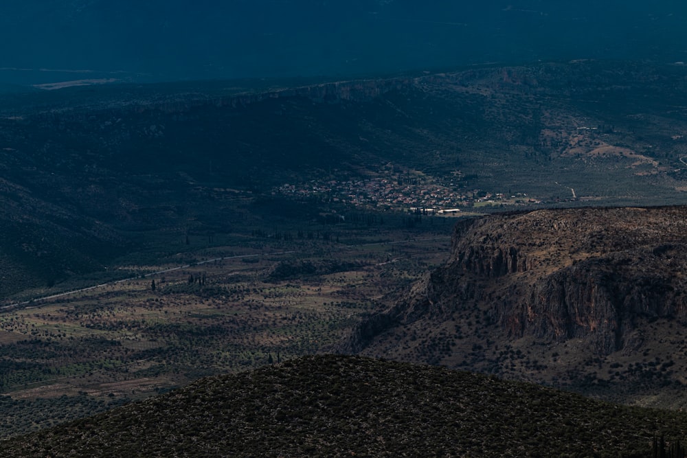 a view of a valley with a mountain in the background