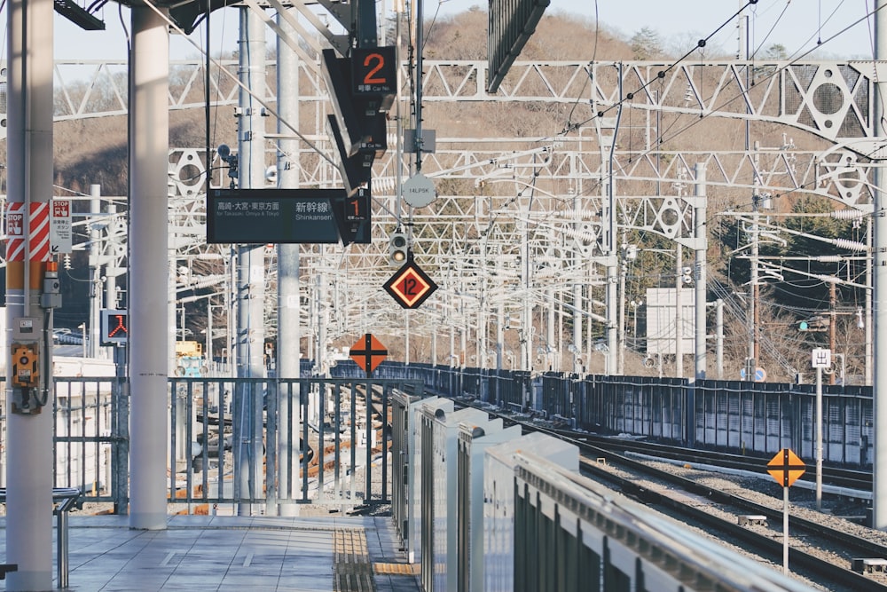 a train station with a train on the tracks