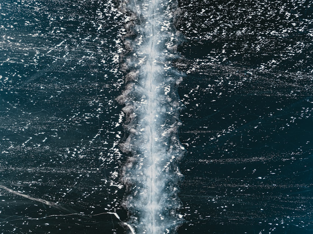 a jet flying through the air over water