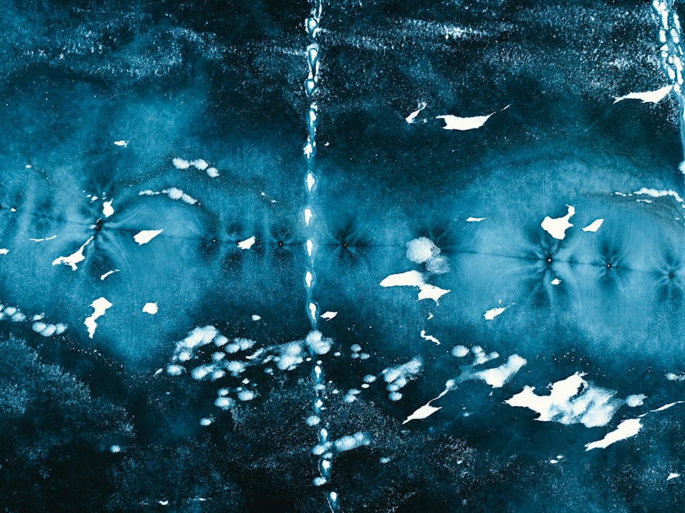 a black and white photo of birds flying in the sky