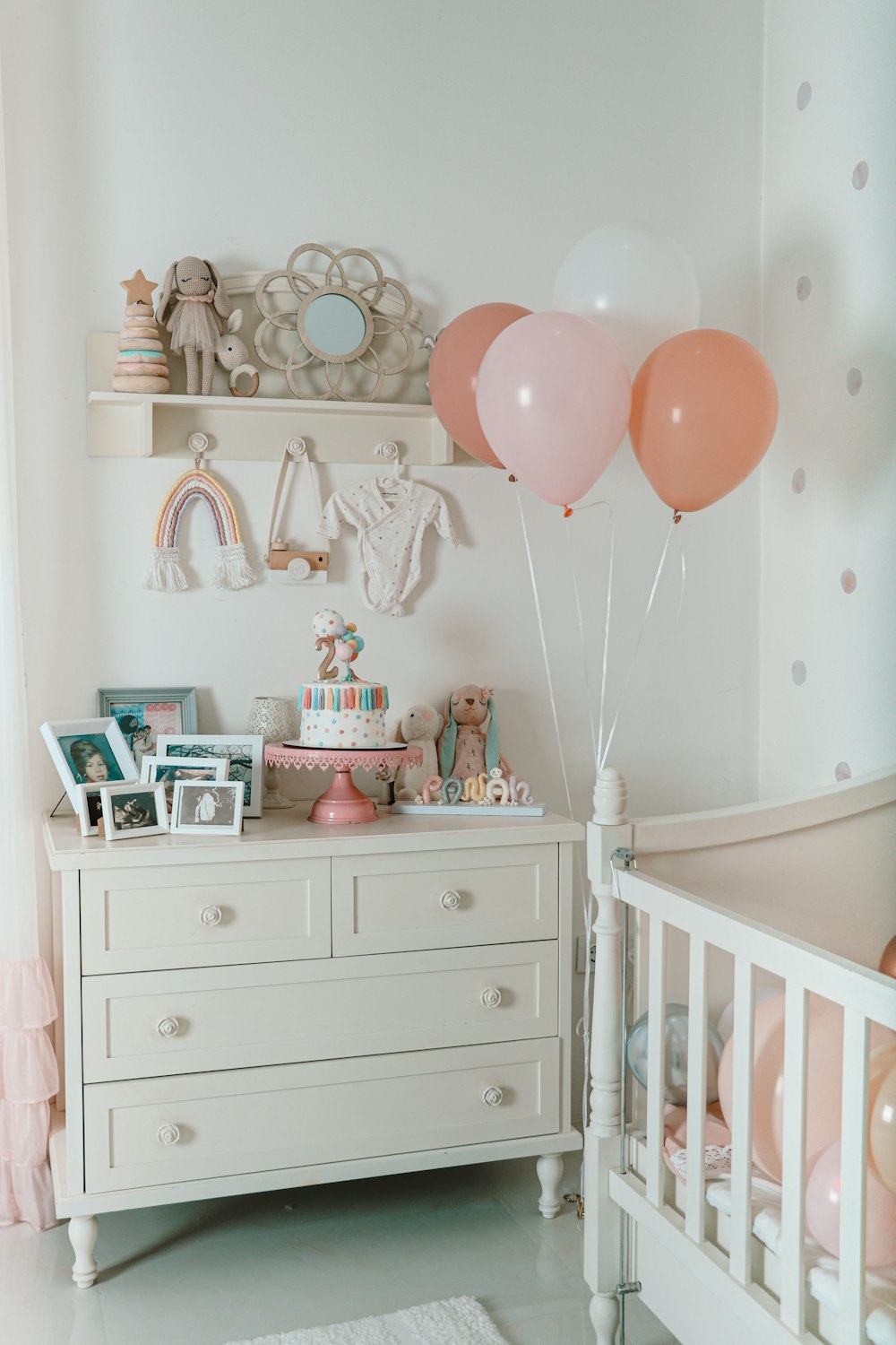 a baby's room with a crib and a dresser