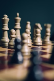 a group of chess pieces sitting on top of a chess board