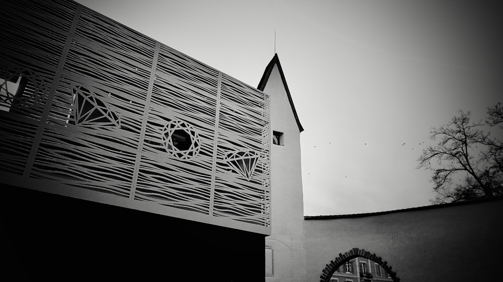 a black and white photo of a building with a clock tower