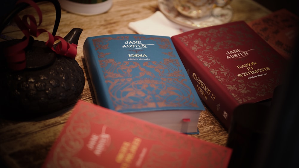 a couple of books sitting on top of a table