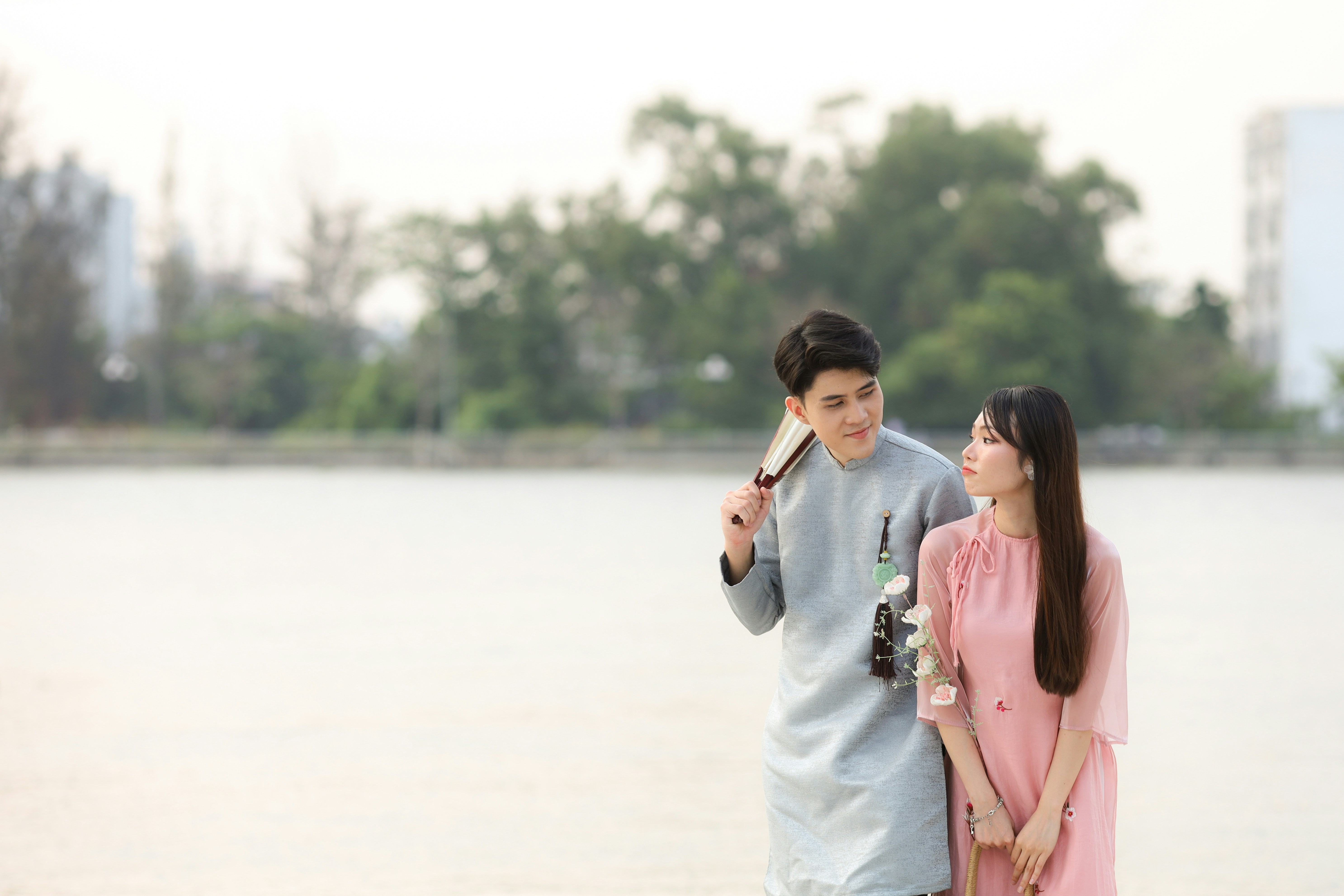 a couple of people standing next to each other