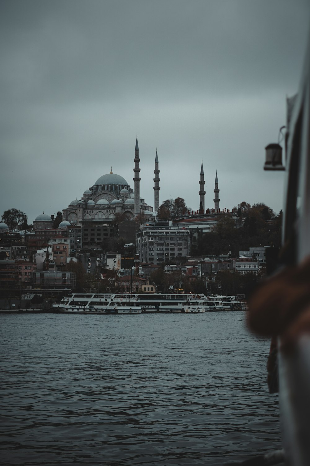 a large body of water with a city in the background