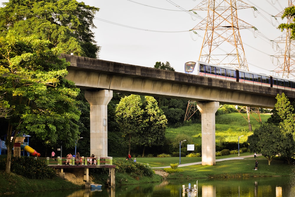 a train traveling over a bridge over a river