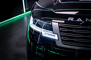 a close up of a car with a green light