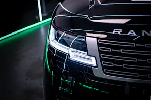 a close up of a car with a green light