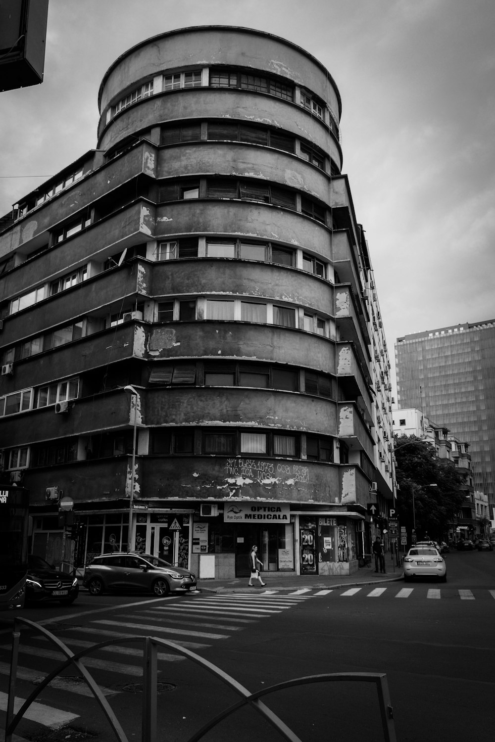 a very tall building sitting on the side of a road